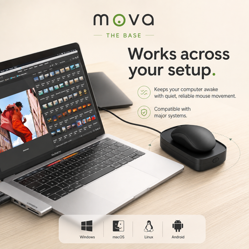 A mouse sitting on The Base beside an open laptop, cable connected